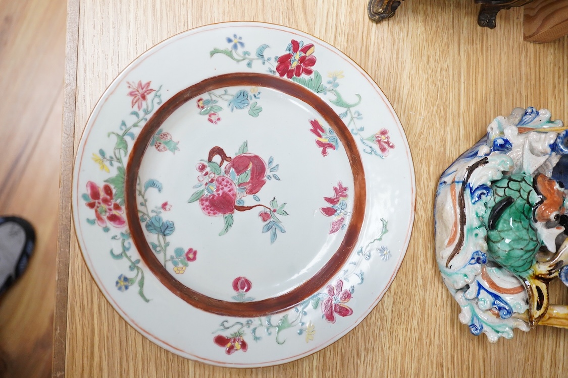 An 18th century Chinese porcelain plate enamelled with flowers and a Chinese Sancai type wall pocket, largest 25cm high